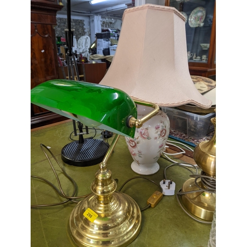 298 - A selection of table lamps to include a brass effect Banker's lamp with green glass shade, a black c... 