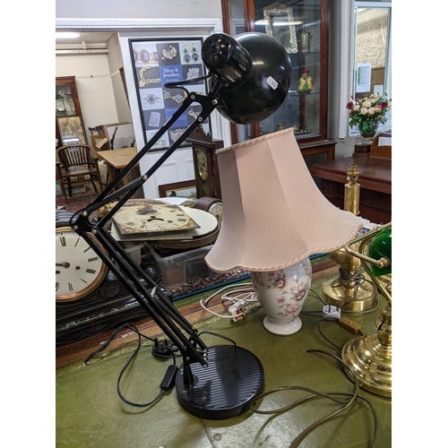 298 - A selection of table lamps to include a brass effect Banker's lamp with green glass shade, a black c... 