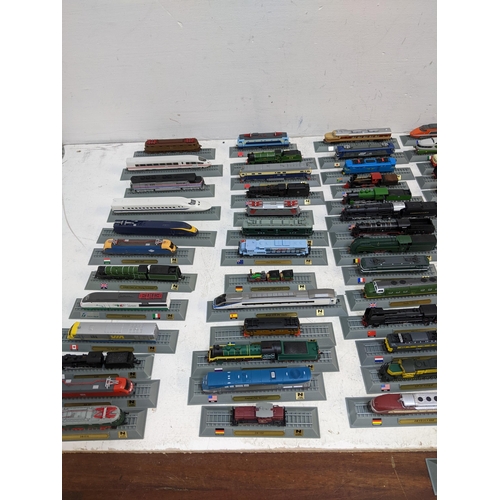 302 - A large collection of Del Prado model trains, partially held within a metal case Location: FSR