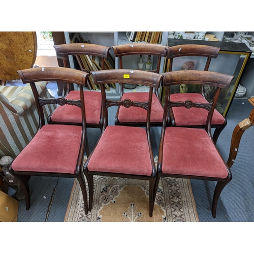 306 - A set of six Regency mahogany bar back dining chairs on sabre front legs
Location: LAB