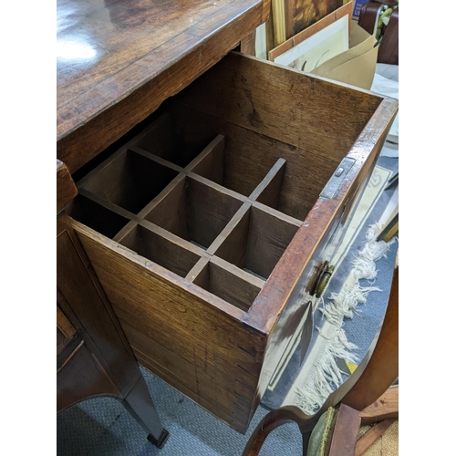 311 - A Regency mahogany breakfront sideboard having cellarette drawer, long drawer and single cupboard do... 