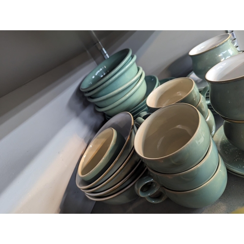 313 - Mixed stoneware to include Denby Regency green cups and saucers and other items, along with similar ... 