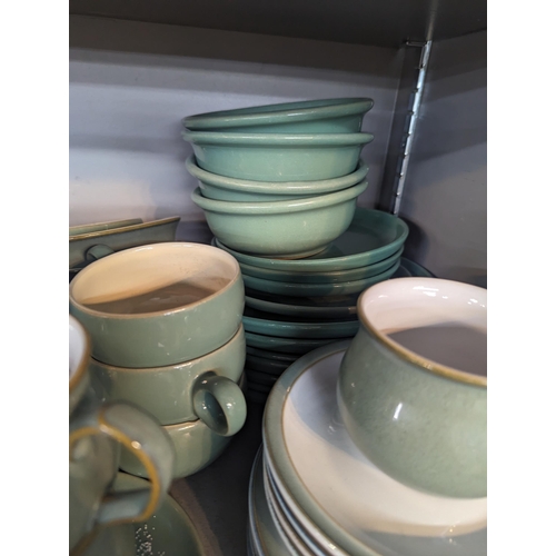 313 - Mixed stoneware to include Denby Regency green cups and saucers and other items, along with similar ... 