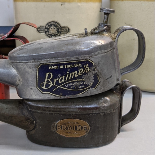 317 - Motoring memorabilia to include three oil cans, one unbranded and two branded Braimes/Braime, a Wait... 