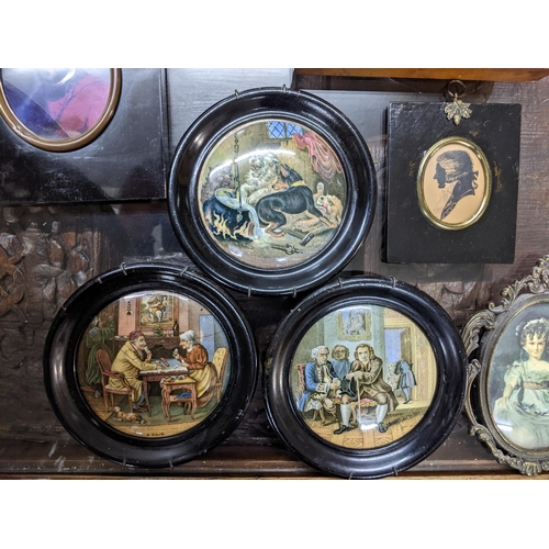 373 - A group of three framed Victorian pot lids, a silhouette portrait of a gentleman, reverse painted pi... 