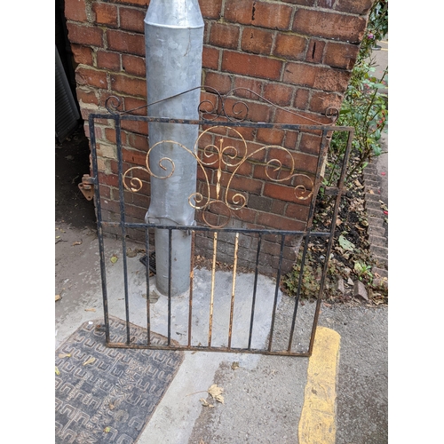 374 - A small wrought iron garden gate, 102cm h x 84cm w, together with two larger wrought iron gates, 99c... 