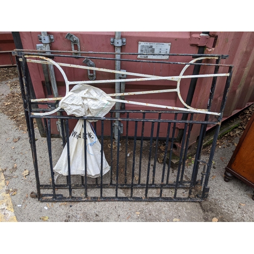 374 - A small wrought iron garden gate, 102cm h x 84cm w, together with two larger wrought iron gates, 99c... 