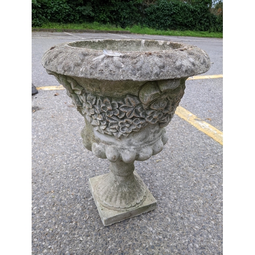 379 - A reconstituted stoneware garden planter having a floral design and on square base
Location: DH