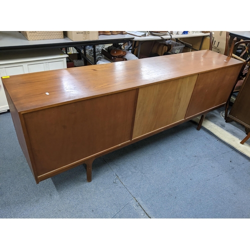 380 - A mid 20th century McIntosh teak sideboard having four drawers flanked by cupboard doors, 76.5cm h x... 