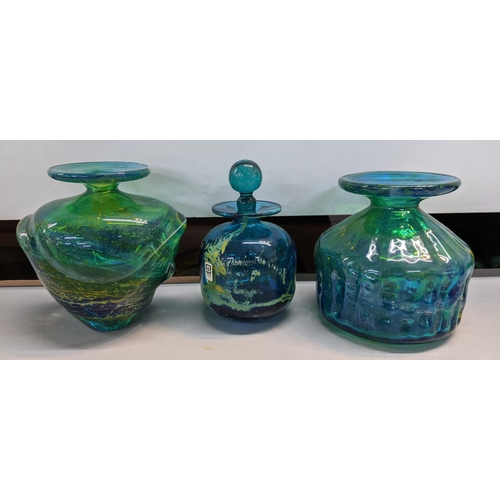 436 - Nine pieces of Mdina glass to include a blue and green vase with a swirling design and a flared rim ... 