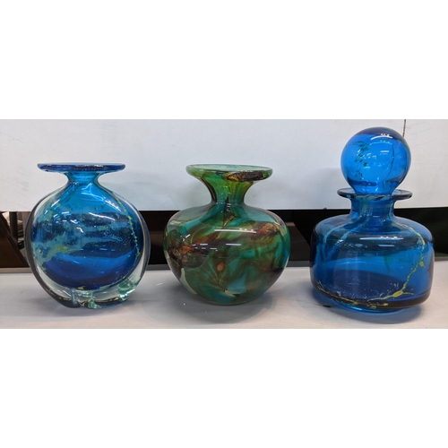 437 - Nine pieces of Mdina glass to include a blue and white fish vase and a green seahorse paperweight (b... 