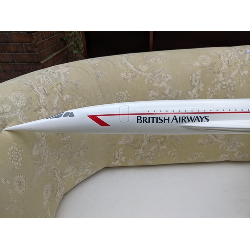 459 - A large travel agents advertising fiberglass model of a British Airways Concorde, 170cm long, on a s... 