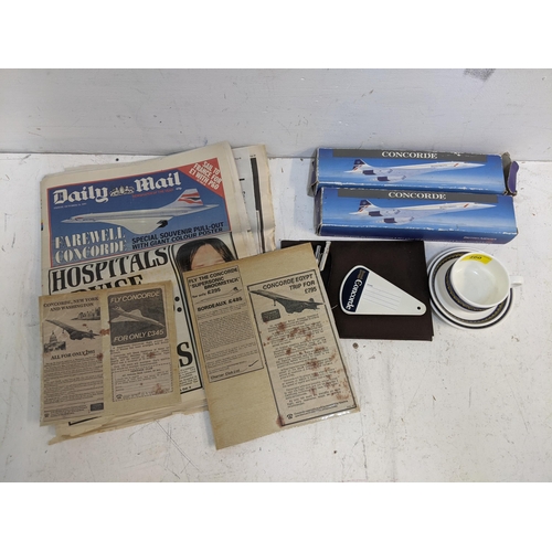 460 - Concorde related items to include a Royal Doulton cup, saucer and plate, two models , two pens, note... 