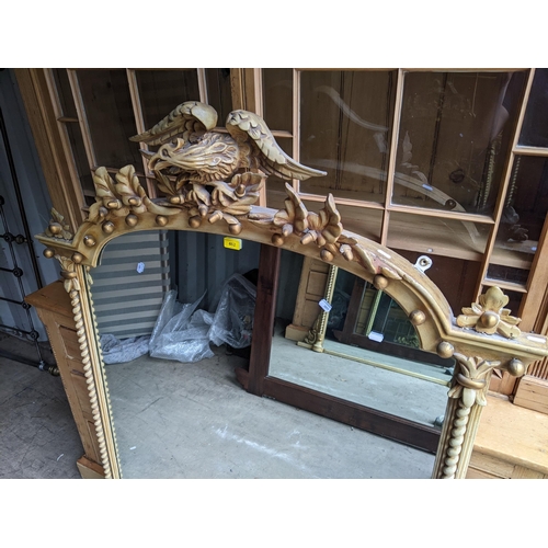 462 - A 19th century overmantel mirror decorated with an eagle finial, twisted columns and applied acorns ... 