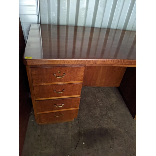 487 - An early/mid 20th century walnut twin pedestal desk having four drawers and single cupboard door, 76... 