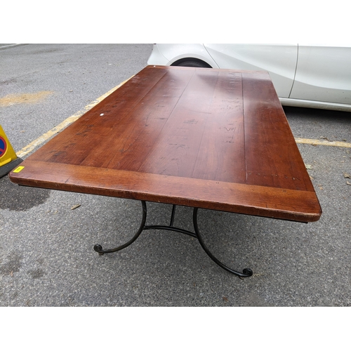 488 - A modern plank constructed rectangular dining table on wrought iron splayed legs, 75cm h x 183cm lon... 