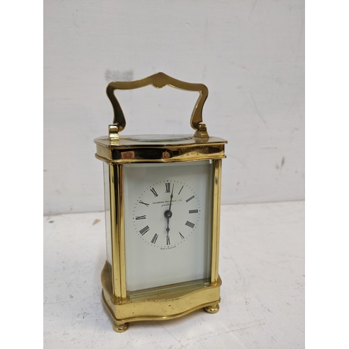 535 - A late 20th century brass cased carriage clock, 5 windows, the face with retailer's Diamond Boutique... 