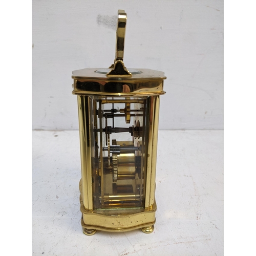 535 - A late 20th century brass cased carriage clock, 5 windows, the face with retailer's Diamond Boutique... 