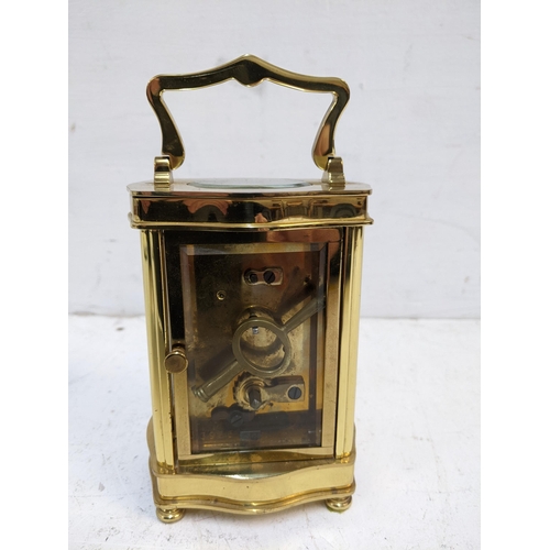 535 - A late 20th century brass cased carriage clock, 5 windows, the face with retailer's Diamond Boutique... 