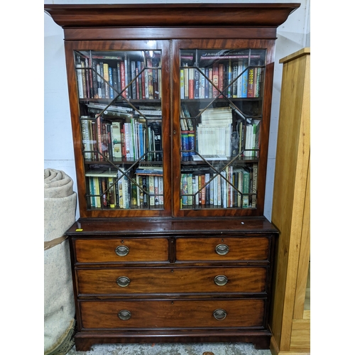 539 - A Victorian mahogany secretaire bookcase, shaped cornice above twin astragal glazed doors, the base ... 