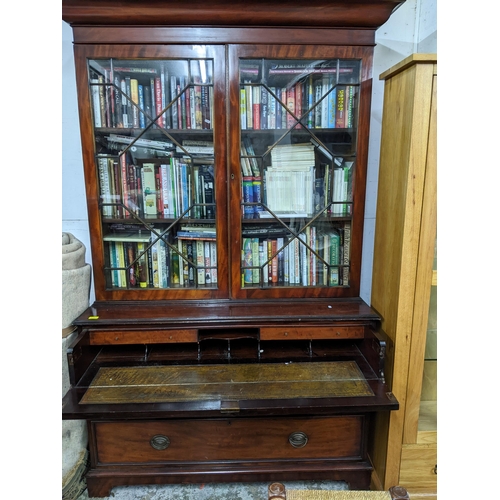 539 - A Victorian mahogany secretaire bookcase, shaped cornice above twin astragal glazed doors, the base ... 