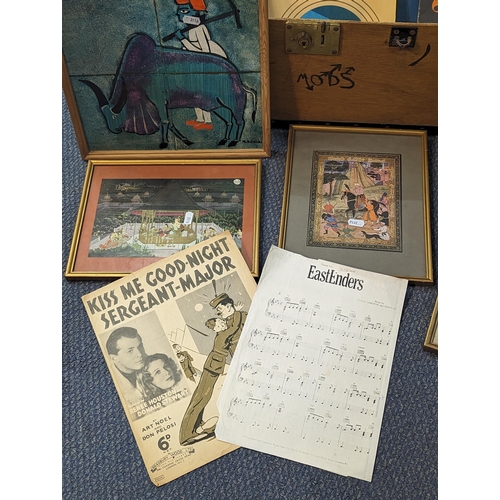 547 - A mixed lot to include a wooden trunk, mixed framed and glazed silks, and a tie signed N Solanki, mu... 