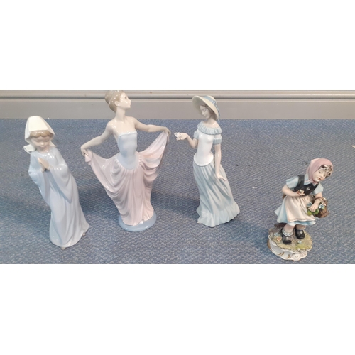 561 - A group of late 20th century china figures to include Lladro and Capodimonte to include one signed T... 