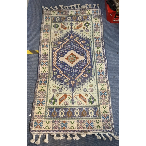 68 - A handwoven Turkish Kazak design rug with a central symmetrical gull with repeating motifs around th... 