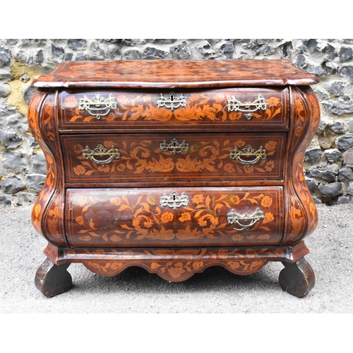 122 - A Dutch burr walnut and marquetry chest of drawers, 19th century, of serpentine form, the top inlaid... 