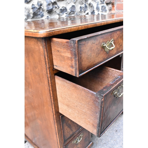 123 - An early George III burr walnut and feather-banded kneehole desk, the bookmatched veneer top with he... 