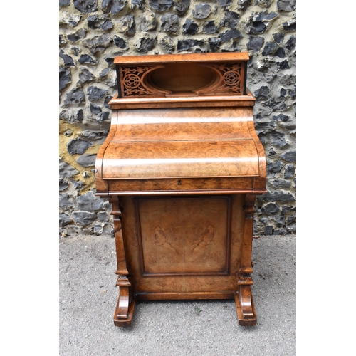 124 - A Victorian burr walnut piano Davenport, circa 1870, the pop-up top with fret-work letter compartmen... 