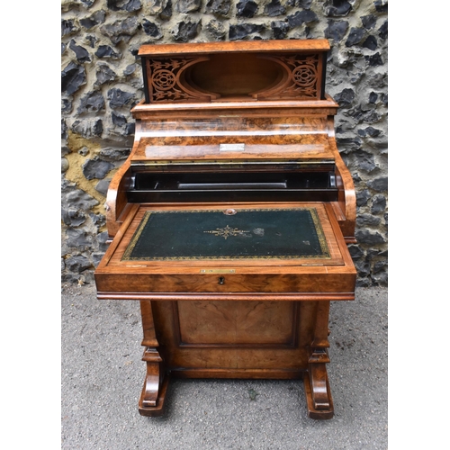 124 - A Victorian burr walnut piano Davenport, circa 1870, the pop-up top with fret-work letter compartmen... 