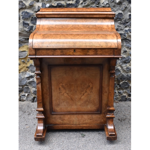 124 - A Victorian burr walnut piano Davenport, circa 1870, the pop-up top with fret-work letter compartmen... 