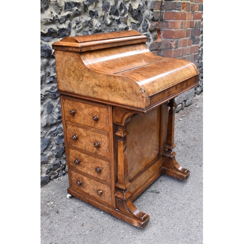 124 - A Victorian burr walnut piano Davenport, circa 1870, the pop-up top with fret-work letter compartmen... 