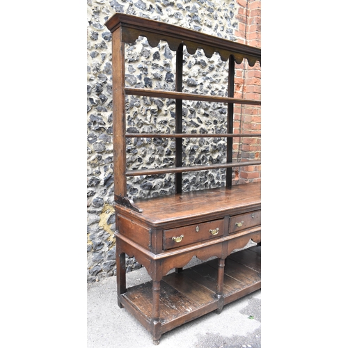 125 - A George III oak open potboard dresser, in two sections, designed with moulded cornice above three s... 