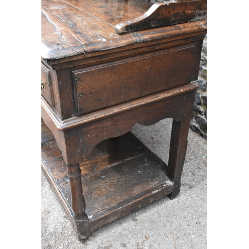 125 - A George III oak open potboard dresser, in two sections, designed with moulded cornice above three s... 