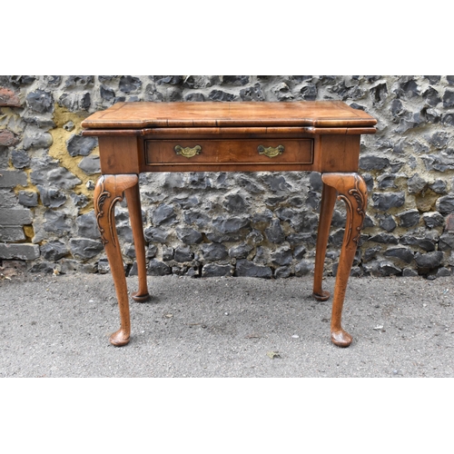 126 - A George II style figured walnut card table, 19th century, the bookmatched veneer top with herringbo... 