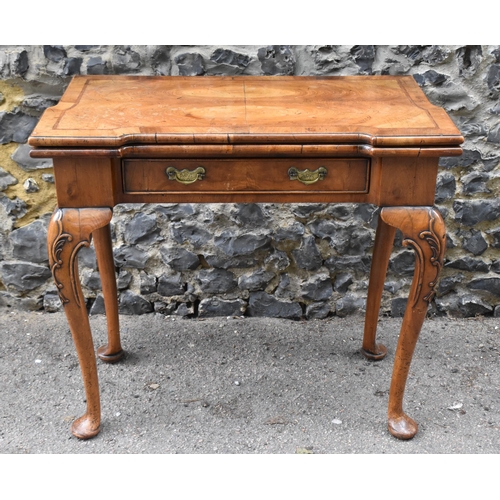 126 - A George II style figured walnut card table, 19th century, the bookmatched veneer top with herringbo... 