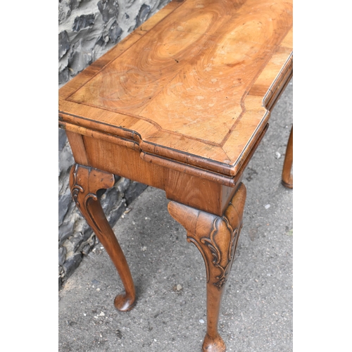 126 - A George II style figured walnut card table, 19th century, the bookmatched veneer top with herringbo... 