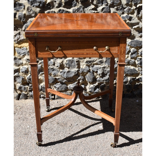 129 - An Edwardian satinwood envelope card table by Maple & Co, the square top with each flap string inlai... 