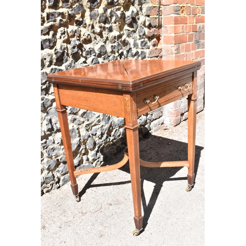 129 - An Edwardian satinwood envelope card table by Maple & Co, the square top with each flap string inlai... 