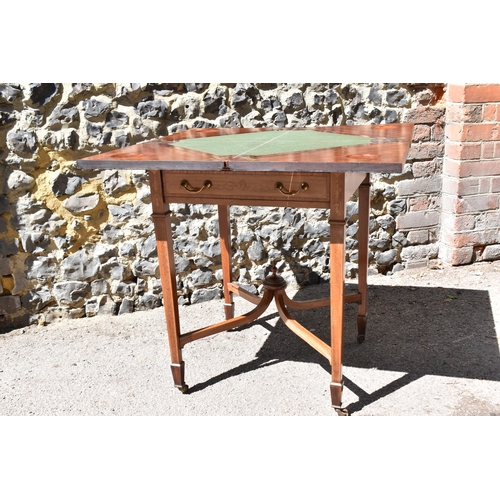 129 - An Edwardian satinwood envelope card table by Maple & Co, the square top with each flap string inlai... 