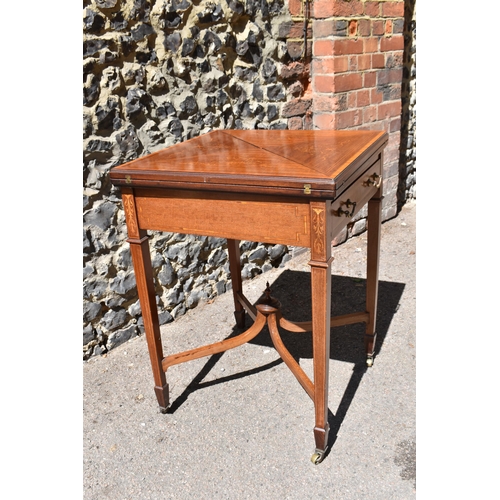 129 - An Edwardian satinwood envelope card table by Maple & Co, the square top with each flap string inlai... 