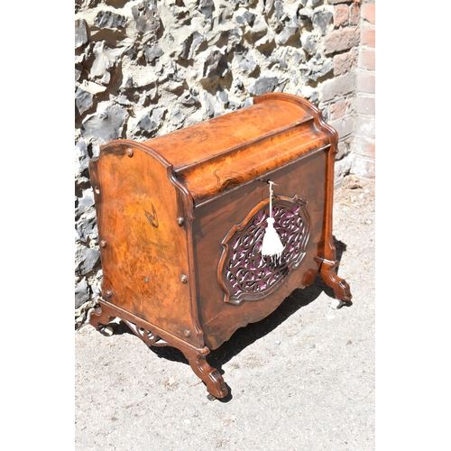 134 - A Victorian burr walnut and rosewood lidded music canterbury, with domed lid enclosing two compartme... 