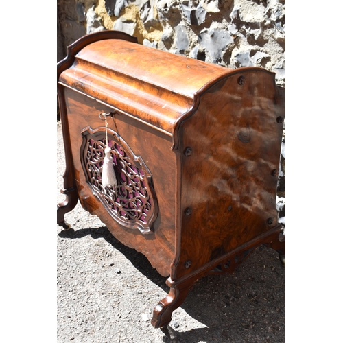 134 - A Victorian burr walnut and rosewood lidded music canterbury, with domed lid enclosing two compartme... 