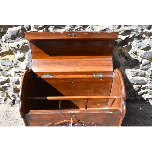 134 - A Victorian burr walnut and rosewood lidded music canterbury, with domed lid enclosing two compartme... 