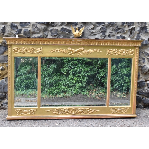 146 - A Regency style gilt overmantle mirror, designed with moulded leaf tip and acanthus scrolls with sat... 