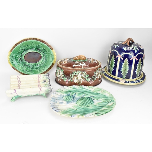 150 - A collection of Victorian majolica ceramics, comprising a 'Forester' stilton cheese dome, a French a... 