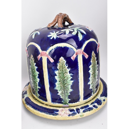 150 - A collection of Victorian majolica ceramics, comprising a 'Forester' stilton cheese dome, a French a... 