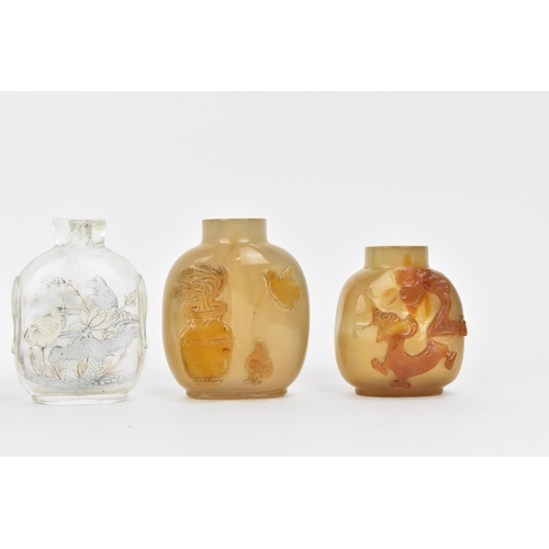 27 - A collection of Chinese glass and agate scent bottles, late 19th/20th century, to include two carved... 